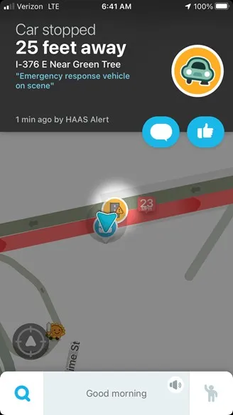 A screenshot of the Waze mobile application alerting a user that a traffic incident is ahead, including how far away the app user is from the crash, along with information that emergency services are on their way to the accident.